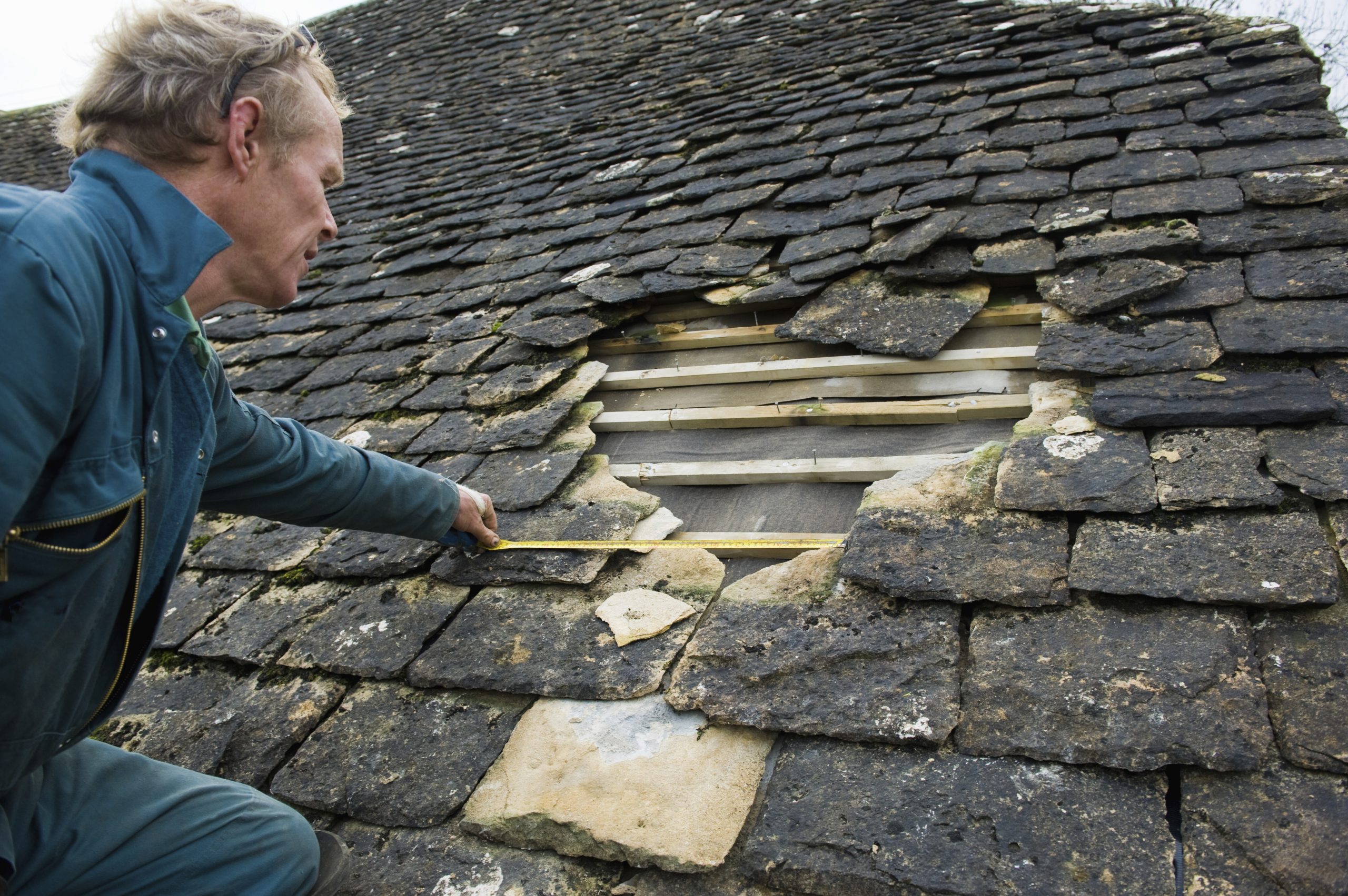 Roofer inspecting entry point