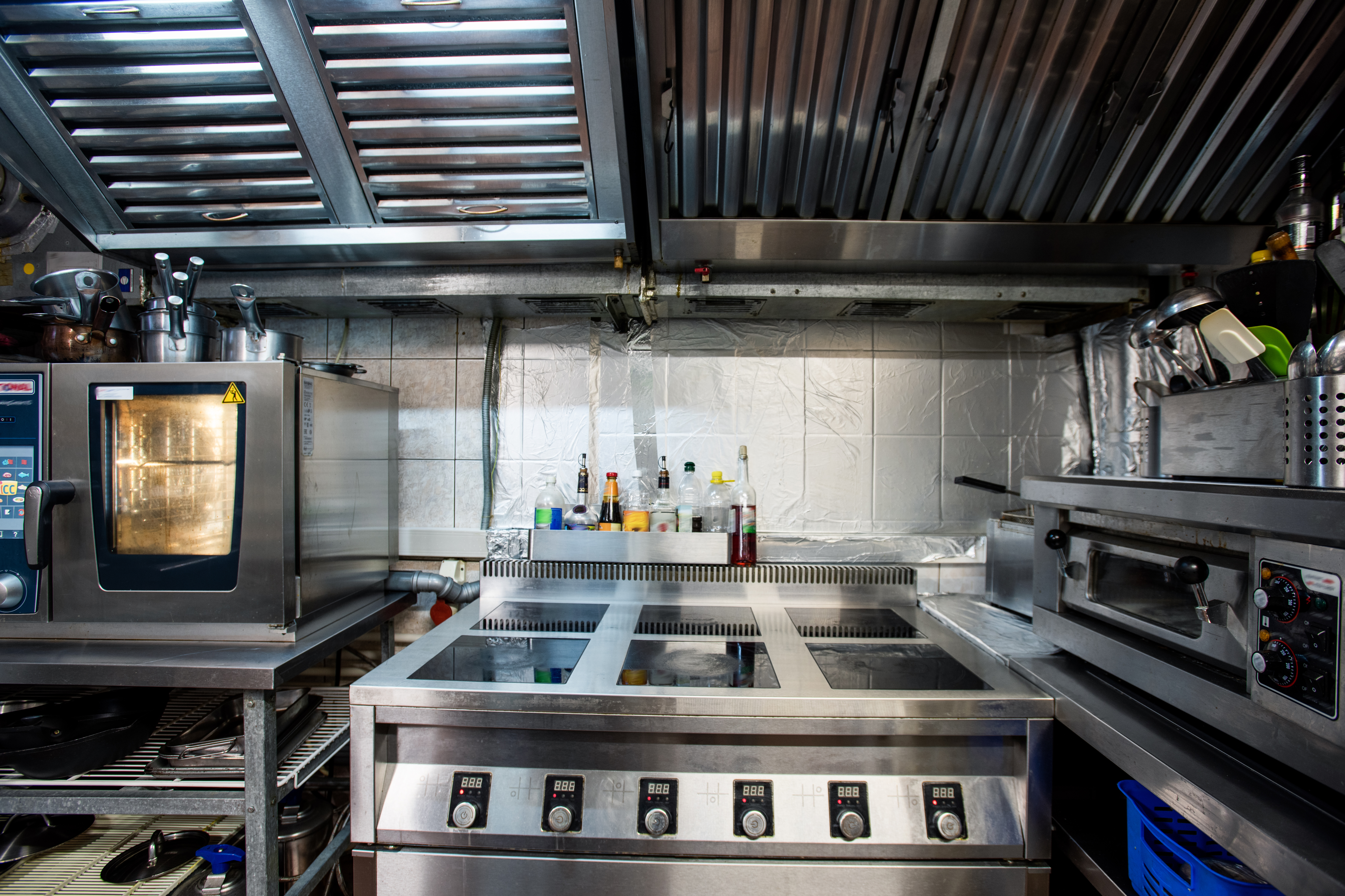 Commercial restaurant kitchen with stainless steel equipment